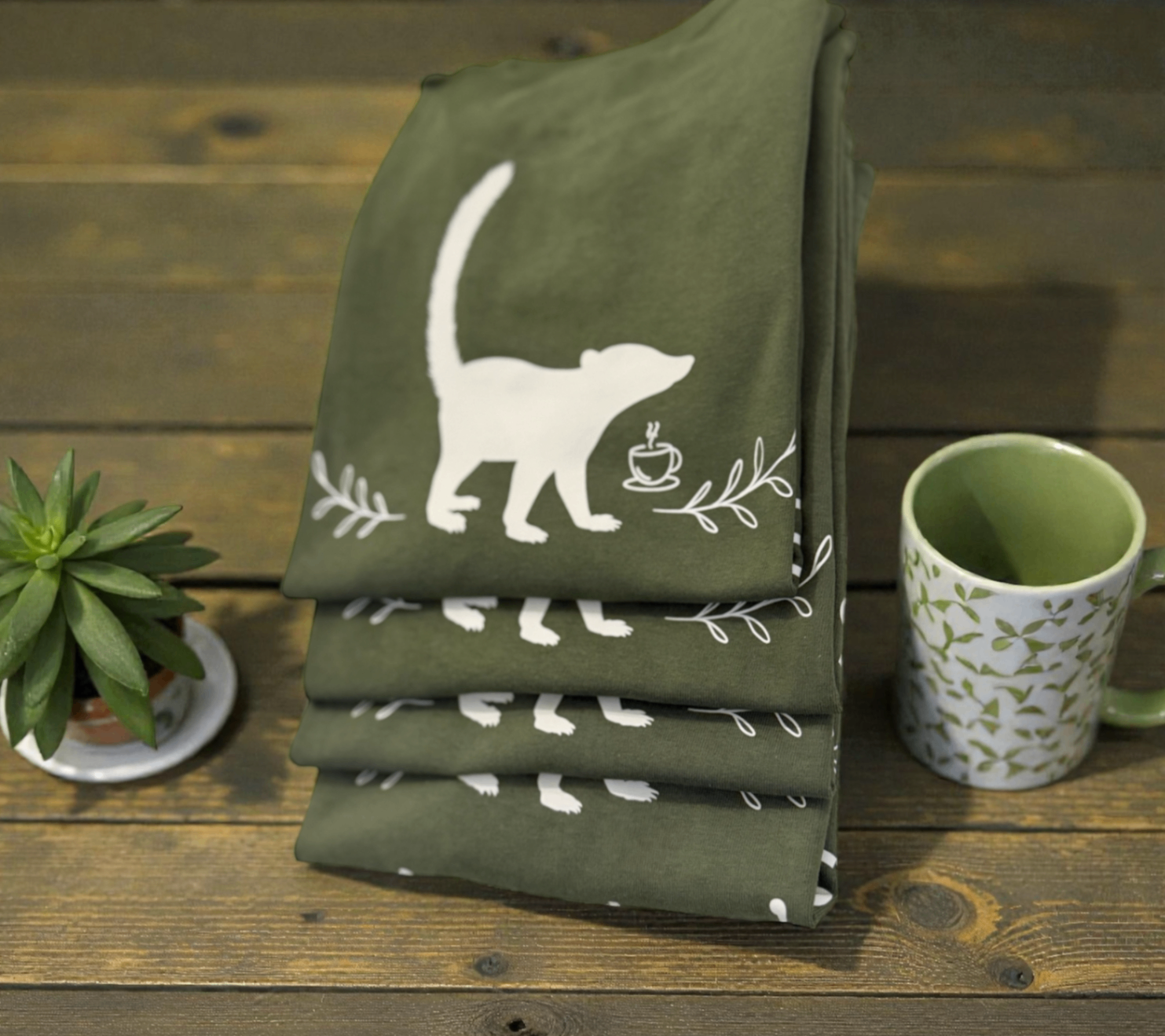 Pila de camisetas Pizote's Café verdes